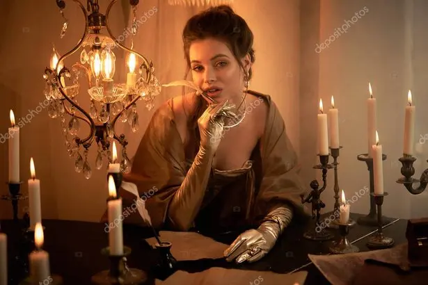 Technician inspecting flickering industrial light fixture connected to dimmer