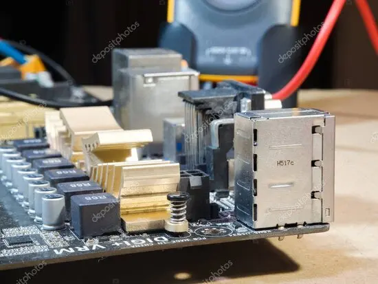 Technician testing a faulty power supply unit on a workbench