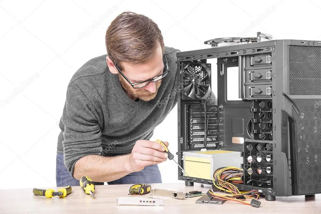 Technician providing computer repair support in an office